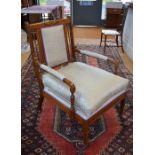 A late 19th/20th century boxwood inlaid rosewood salon open armchair