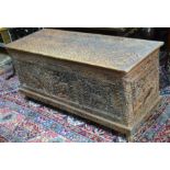 A large antique sandalwood coffer of Asian origin, profusely carved and incised