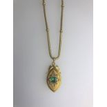 A Victorian yellow gold diamond and emerald set pendant on chain