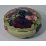 A Walter Moorcroft powder bowl and cover decorated with the 'Clematis' pattern