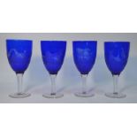 A set of four 19th century Bristol blue glass goblets engraved with cock fighting scenes