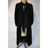 An early 1900s black silk velvet evening cape, two vintage devore dresses etc.