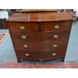 A George III mahogany bowfront chest of two short over three long graduated cock-beaded drawers