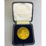 A South African 24ct gold presentation medallion