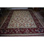 A handmade Turkish Lal carpet, the ivory ground with linked vine design, 321cm x 242 cm