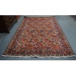 A Persian Baktiari carpet, the all-over diamond tile design in colours, 305 cm x 203 cm