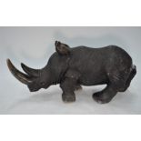 A large African realistically carved stone rhinoceros