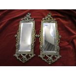 Pair of brass-framed decorative mirrors