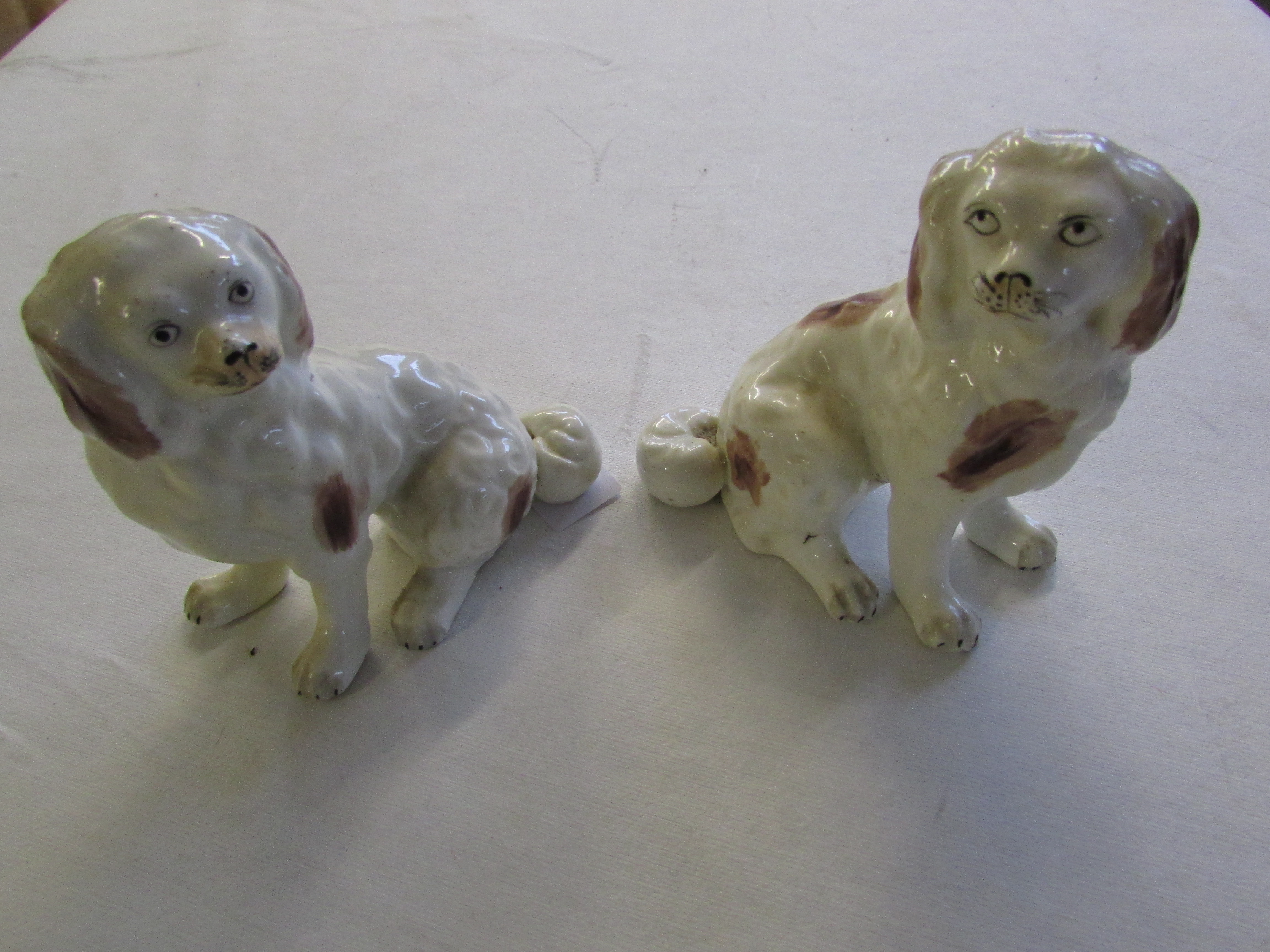 A pair of early 19th Century Staffordshire spaniels