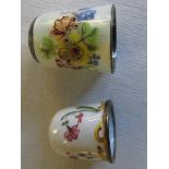 Two floral enamelled Victorian thimbles.