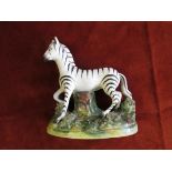 Early 19th Century Staffordshire pottery zebra on mound