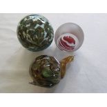 Three glass paperweights