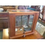 Mahogany cased 'apothecary' scales and weights.