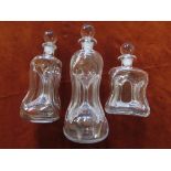 Three clear glass 'glug glug' decanters