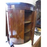 Mahogany bow-fronted corner cupboard