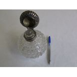 Large silver-lidded scent bottle