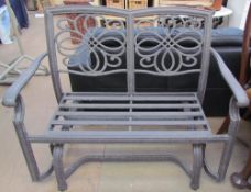 A metal rocking two seater settee