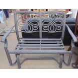 A metal rocking two seater settee