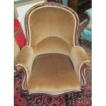 A Victorian walnut framed gentleman's library chair with a pad upholstered back,