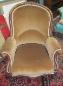 A Victorian walnut framed gentleman's library chair with a pad upholstered back,