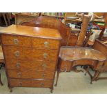 A 20th century walnut bedroom suite comprising a wardrobe, dressing table,