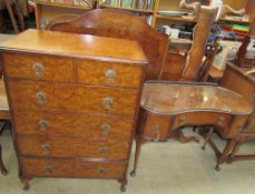 A 20th century walnut bedroom suite comprising a wardrobe, dressing table,