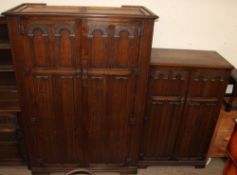 A 20th century oak three piece bedroom suite, including two wardrobes and a dressing table,