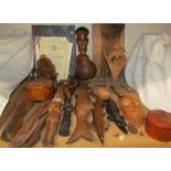 A collection of Oceanic and African carvings including figures, fish, animals,