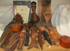A collection of Oceanic and African carvings including figures, fish, animals,