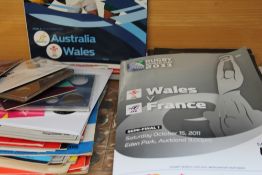 A collection of rugby programmes together with commemorative coins etc