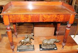 A Victorian mahogany washstand with a three quarter gallery above two drawers on turned tapering