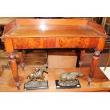 A Victorian mahogany washstand with a three quarter gallery above two drawers on turned tapering