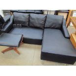 A black leather three seater settee with day bed,