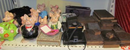 Assorted Natwest piggy banks together with Polaroid cameras and copper printing plates