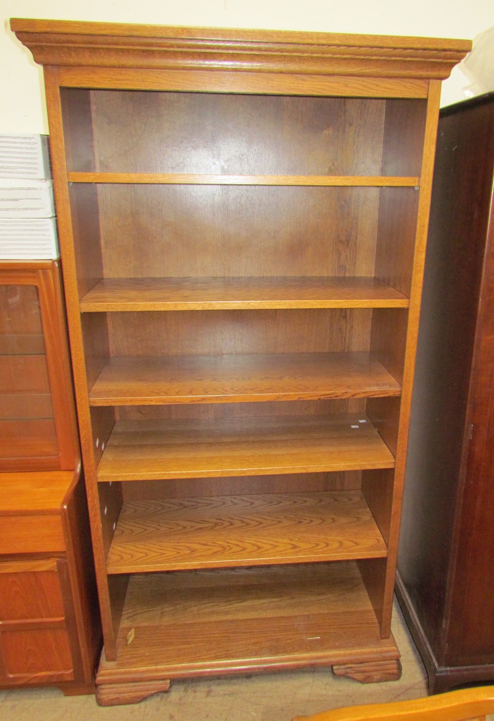 A 20th century oak bookcase the moulded cornice above open shelves - Image 2 of 2