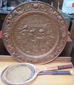 A stamped brass plaque together with two tennis rackets