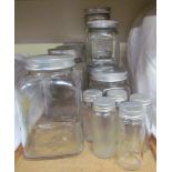 A collection of Easiwork glass and aluminium storage jars