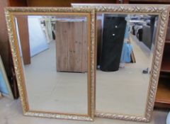 Two rectangular gilt wall mirrors together with prints,
