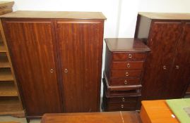 A modern stag bedroom suite including two wardrobes, chest of drawers,