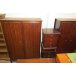 A modern stag bedroom suite including two wardrobes, chest of drawers,