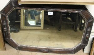 An oak framed wall mirror together with a large quantity of assorted decorative pictures and