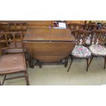 A set of four oak dining chairs with prince of Wales feathers motif,