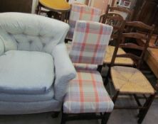 A 19th century upholstered arm chair together with a pair of ladder back bedroom chairs,