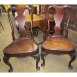 A pair of George III mahogany dining chairs,