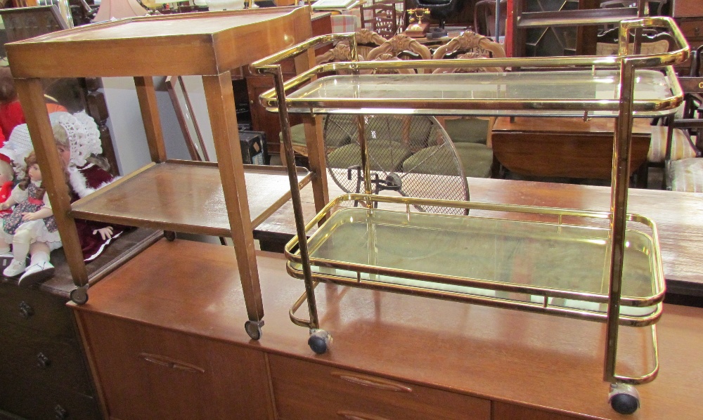 A teak trolley together with a brass and glass tea trolley