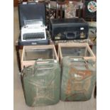 A pair of oak dining chairs together with a table, two fuel cans,