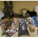 Assorted African carved figures and masks together with a Japanese Satsuma teapot, hats,