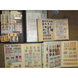 A collection of world stamps contained within five albums