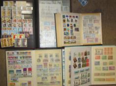 A collection of world stamps contained within five albums