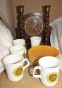 An oak mantle clock together with a pair off oak barley twist candlesticks and a Meakin sunflower